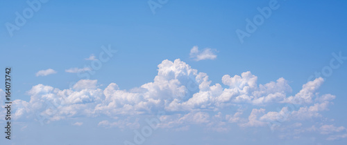 Photography White curly clouds in a blue sky. Sky background