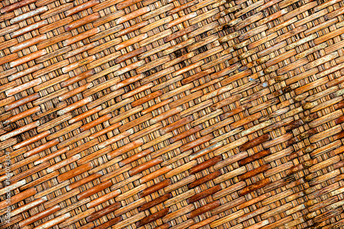 Backgrounds of bamboo interlaced handicraft with top view closeup
