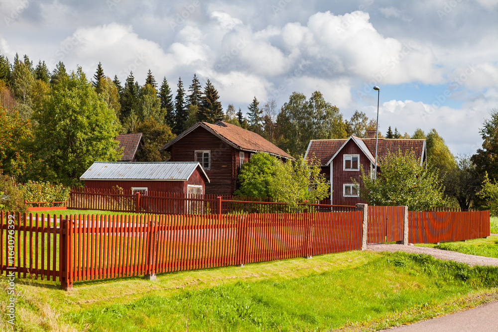 Typical scandinavian wooden houses in village. Dalarna county, Sweden.