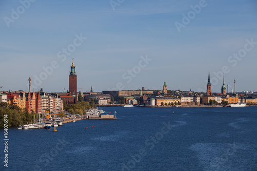 Scenic summer aerial view of old town, city hall and central embankments with boats. Stockholm, Sweden