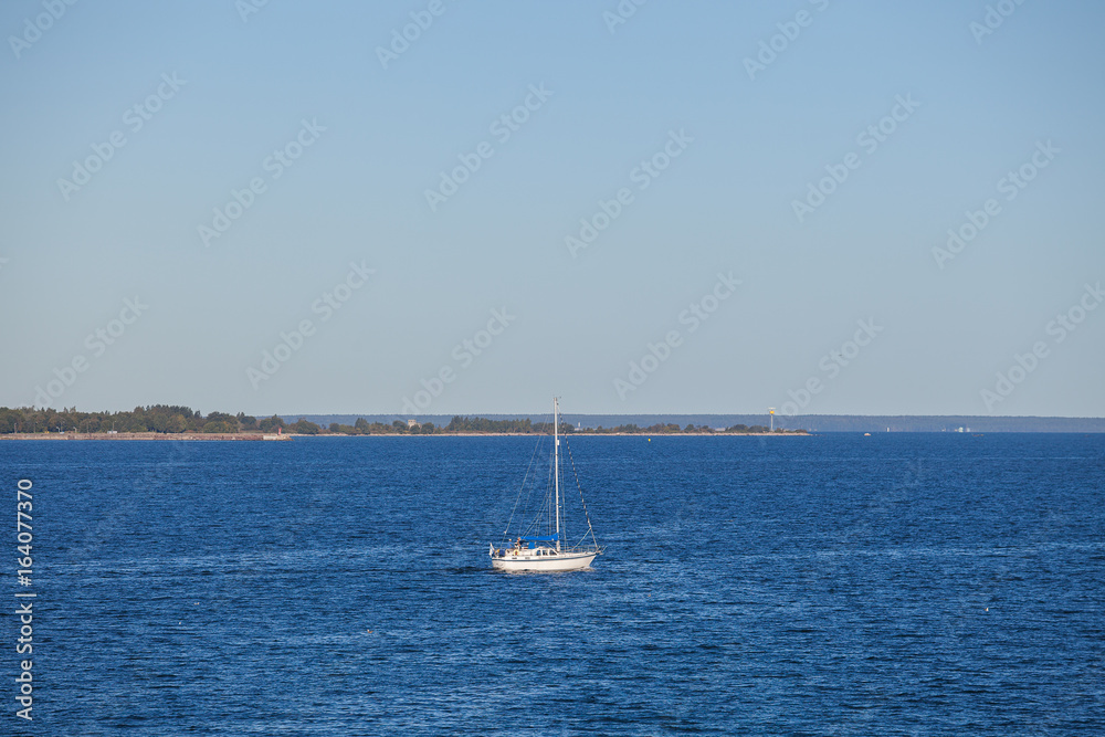 White yacht and summer bright Baltic sea
