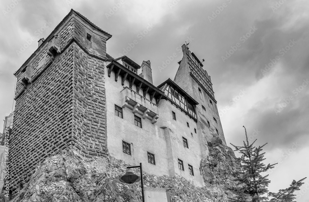 Detailed black and white view of the famous Bran Castle against a gloomy sky, Brasov district, Transylvania, Romania Detailed black and white view of the famous Bran Castle against a gloomy sky, Brasov district, Transylvania, Romania