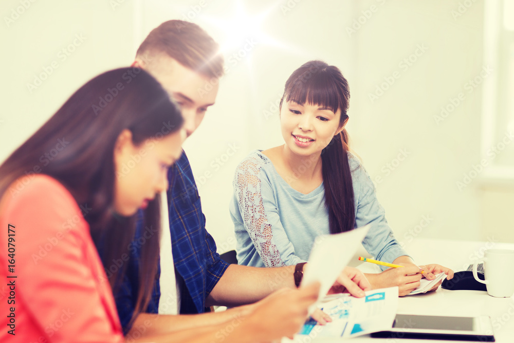 happy creative team or students working at office happy creative team or students working at office