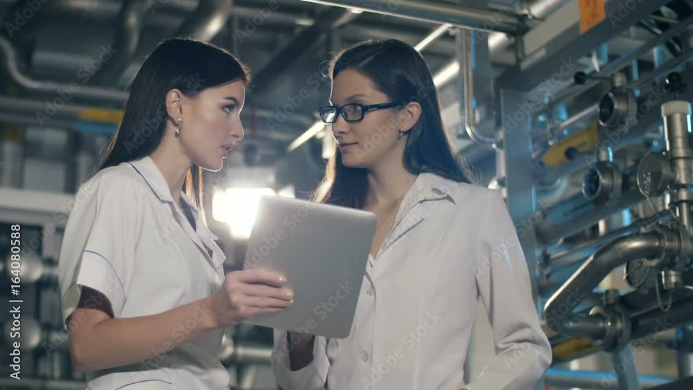 Engineers in mechanical factory working Engineers in mechanical factory working
