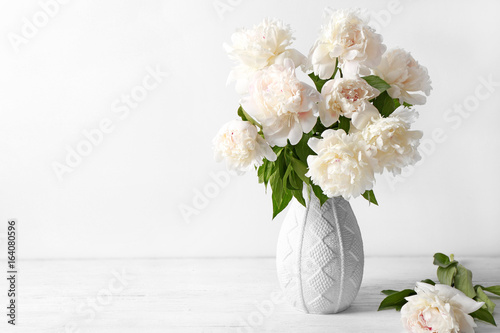 Fototapeta Naklejka Na Ścianę i Meble -  Vase with beautiful peonies on white background