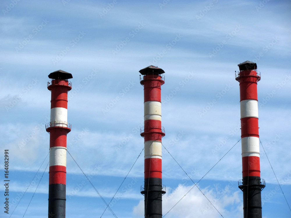 Factory towers against the blue sky Factory towers against the blue sky