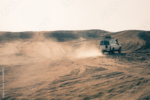 Car driving in desert
