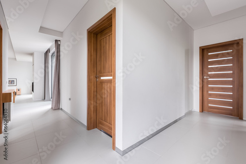 White apartment with wooden doors