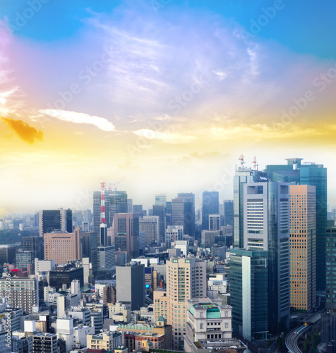 Cityscape of Tokyo city, japan. Aerial skyscraper view of office building and downtown of tokyo with sunset/ sun rise background. Tokyo is metropolis and center of new world's modern busniess © lukyeee_nuttawut