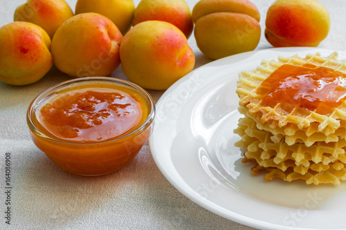 Homemade cookies with apricot jam on a plate photo