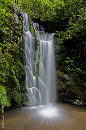 Wolf Creek falls in powerful stream in spring.