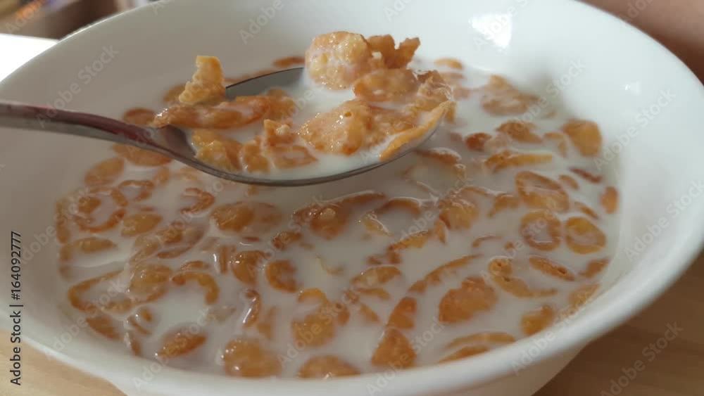 Eating corn flakes in milk for the breakfast Eating corn flakes in milk for the breakfast