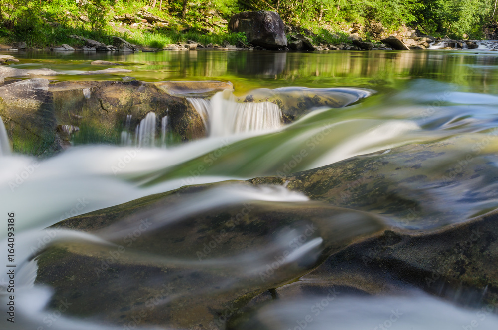background landscape with waterfall in Yaremche vilage in Ukraine background landscape with waterfall in Yaremche vilage in Ukraine