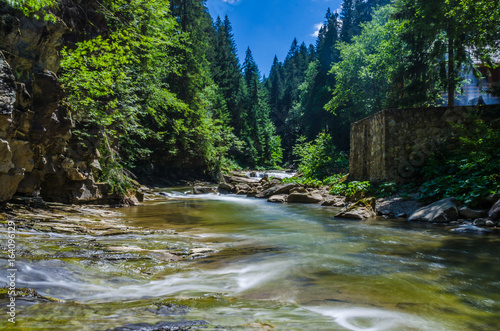 background landscape with waterfall in Yaremche vilage in Ukraine