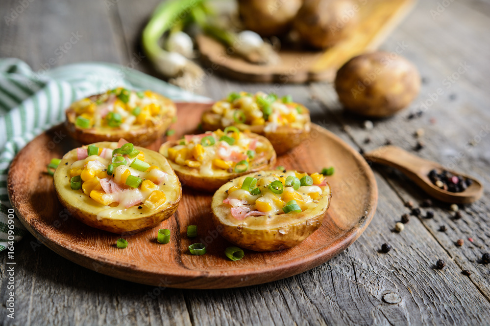 Potato boats filled with corn, ham, cheese and green onion