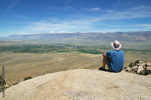 Man Sits On Rock Overlook © Tom