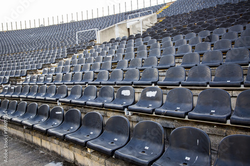 Empty tribune with black seat on soccer sdadion