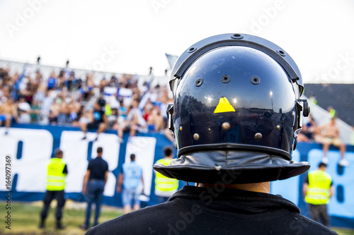 policeman with helmet guarding a sport event © fotosr52