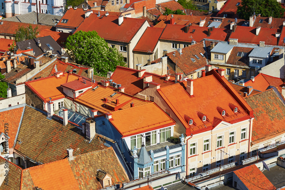 Beautiful colorful buildings with red tile roofs in Vilnius Old Town