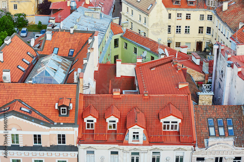 Beautiful colorful buildings with red tile roofs in Vilnius Old Town
