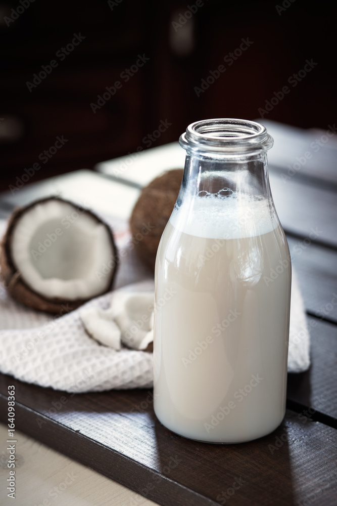 Fresh coconut milk in glass bottle Fresh coconut milk in glass bottle
