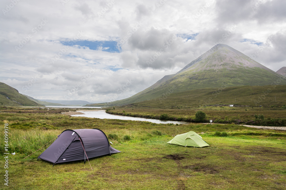 Camping on cloudy Isle of Skye with mountains and river