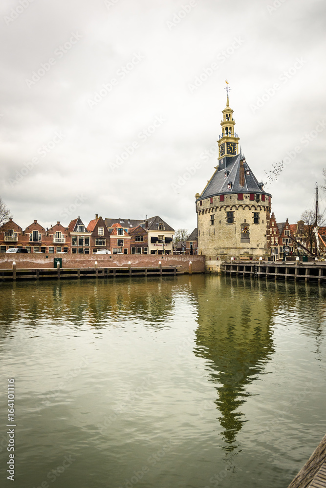 Obraz premium Clock tower building in the harbor of the town of Hoorn, Netherlands