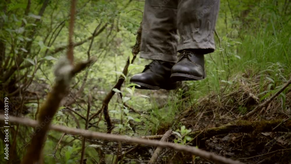 feet of hanged man over the rotten swamp, camera move from left to right feet of hanged man over the rotten swamp, camera move from left to right