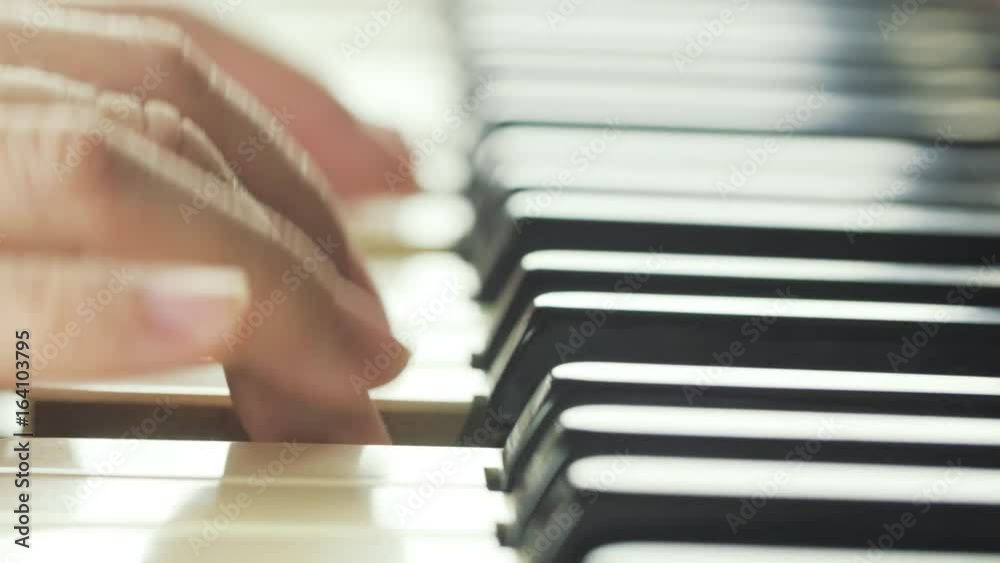 Girl playing on piano close-up 4K Girl playing on piano close-up 4K