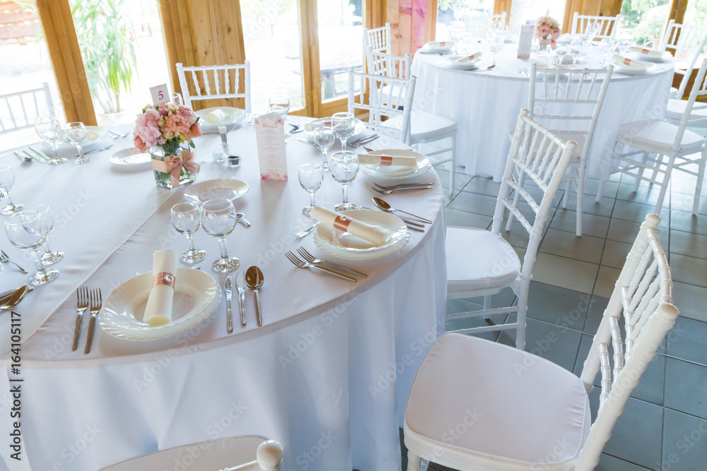 table setting with spoon, knife, plates and glass