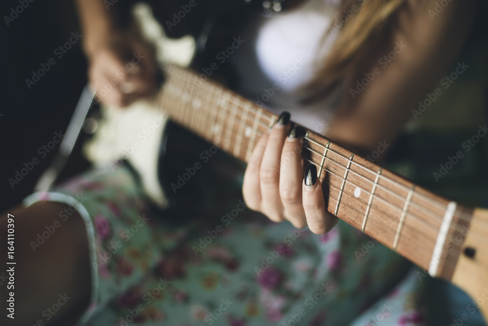Fototapeta premium Girl playing acoustic guitar