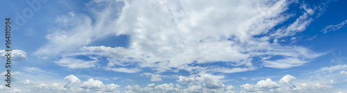 Sunny blue sky background with clouds Panorama Photo