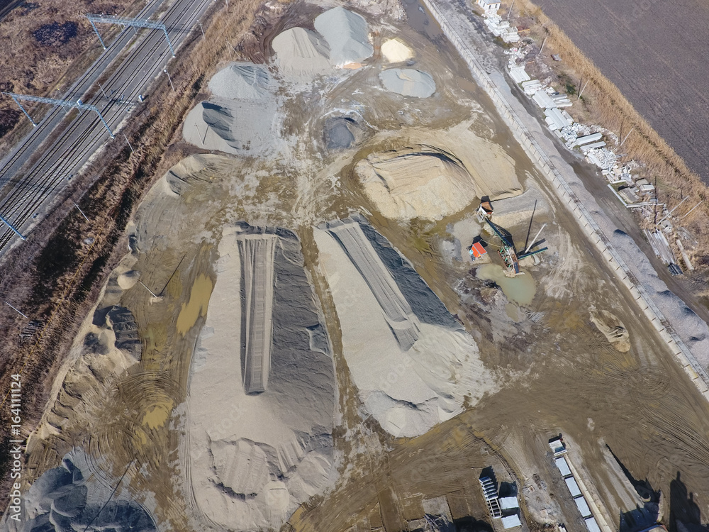 Heaps of rubble and pebbles. for road repair plant. The site wit Heaps of rubble and pebbles. for road repair plant. The site wit