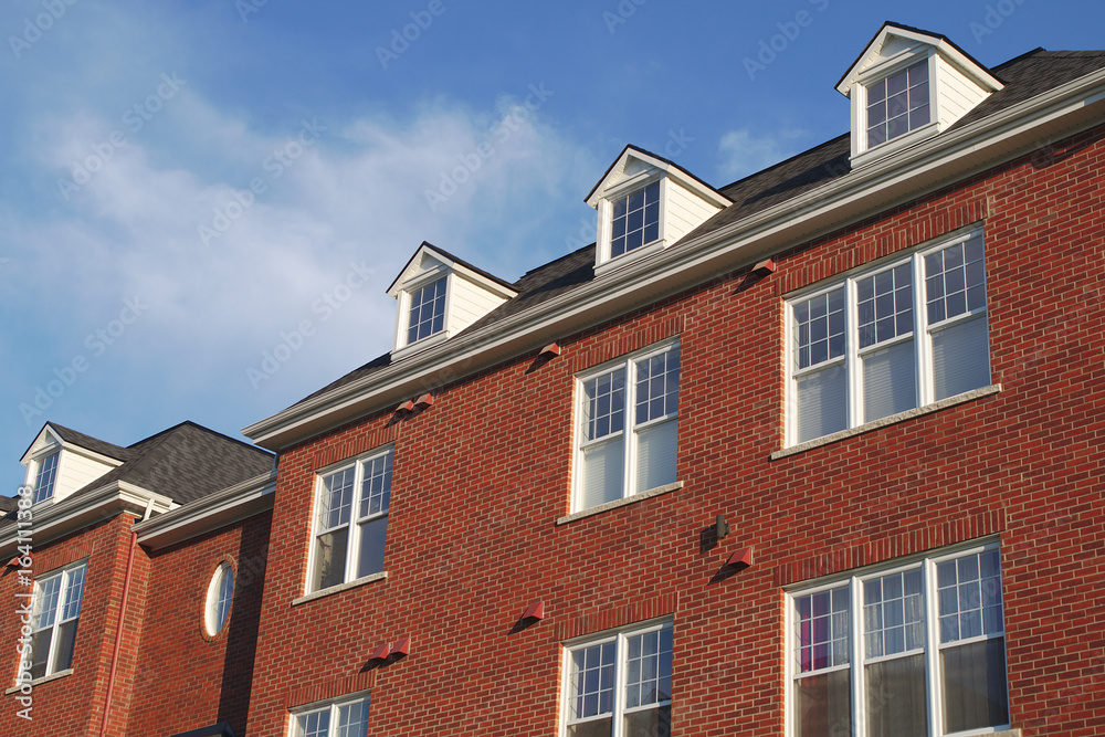 house roof residential skylight dormer red brick wall facade