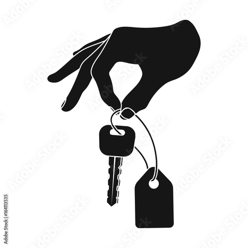 Key with a key ring in his hand. E-commerce single icon in black style vector symbol stock illustration web.