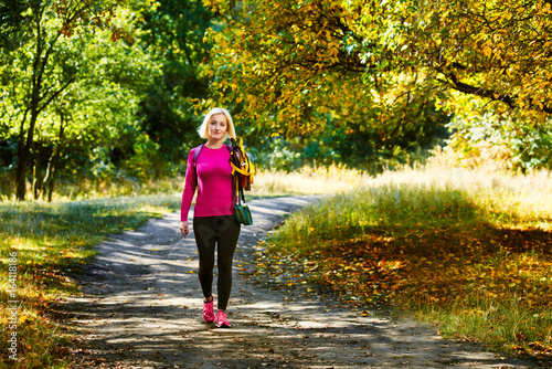 Sportswoman in autumn park