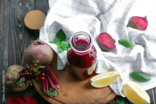 Healthy smoothie with beet root on wooden table