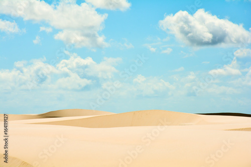 Fototapeta Naklejka Na Ścianę i Meble -  Dune formation under blue sky and clouds