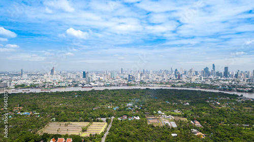 Aerial View of Bangkok skyline and view of Chao Phraya River View from green zone in Bang Krachao, Phra Pradaeng, Samut Prakan Province.