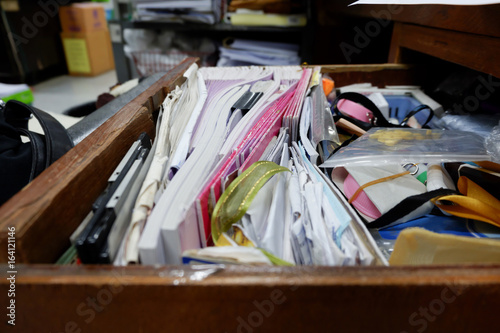 Opened drawer wooden table at  workplace