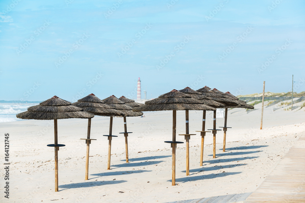 Beach umbrellas. Costa Nova beach. Aveiro.  Portugal
