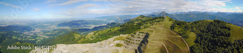 Great landscape on the Padana plain in summer time and the concrete quarry. Panorama from Linzone Mountain, Bergamo, Italy.  photo