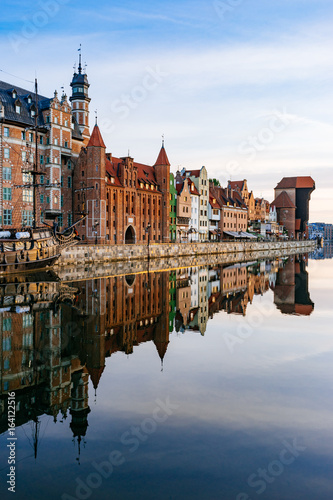 Embankment of Motlawa river with reflection on water, Gdansk