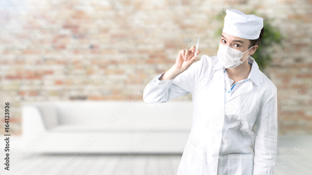 Beautiful medical woman doctor in uniform. Studio painted background. Concept of profitable health care.