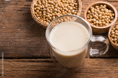 Glass with Soy Milk and Seeds on background