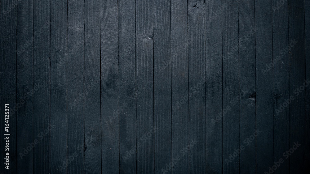 Wooden black texture surface. Top view. Free space for your text. Wooden black texture surface. Top view. Free space for your text.