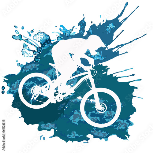 Silhouette of a cyclist riding a mountain bike