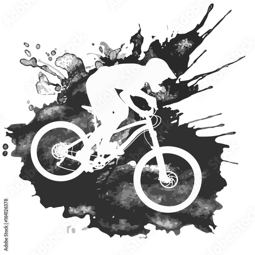 Silhouette of a cyclist riding a mountain bike