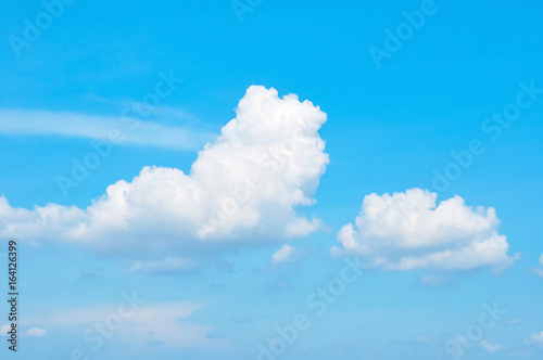 Bright blue sky & clouds as background