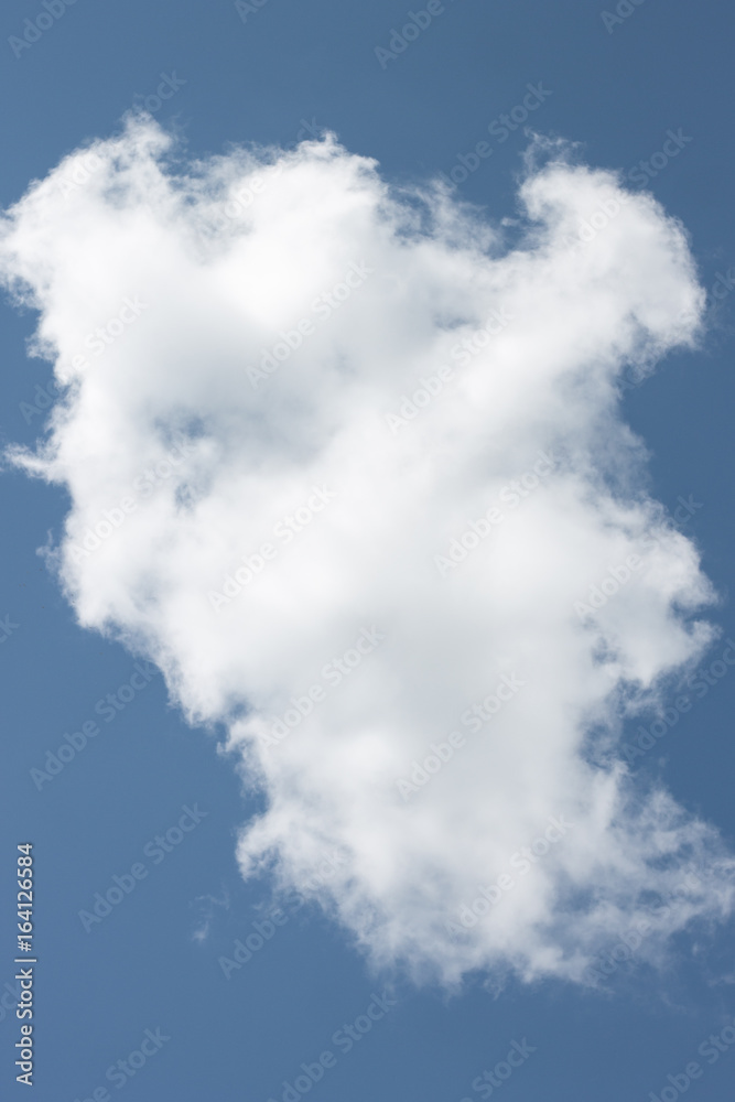 glowing white cloud floating on a rich blue sky glowing white cloud floating on a rich blue sky